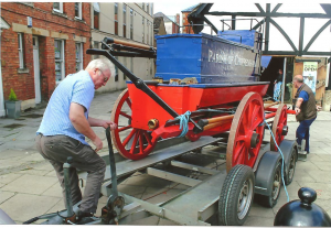 Mike Brotherhood and Mike Stone unloading the fire engine at the Yelde Hall